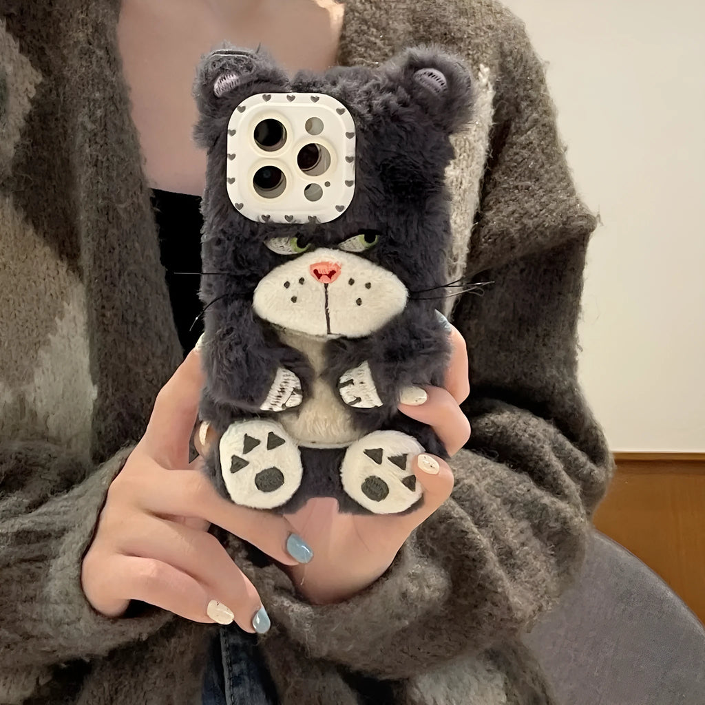 Plush pink phone case with staring cat love lens graphic on a white background