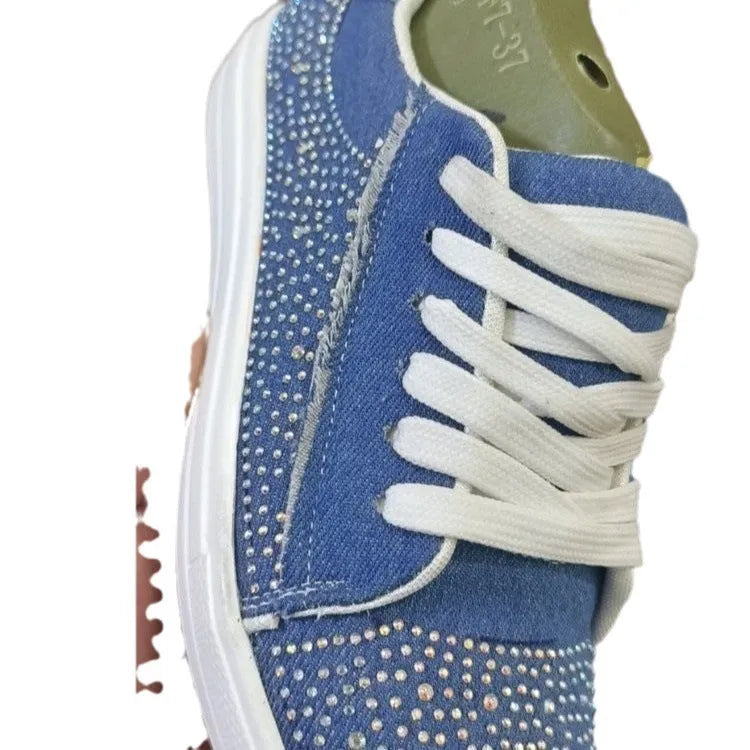Plus size women's black casual sports shoes with rhinestone detail, flat rubber sole, and lace-up front.