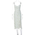 Women's blue lace flower print long suspender dress with a high leg slit on a model.