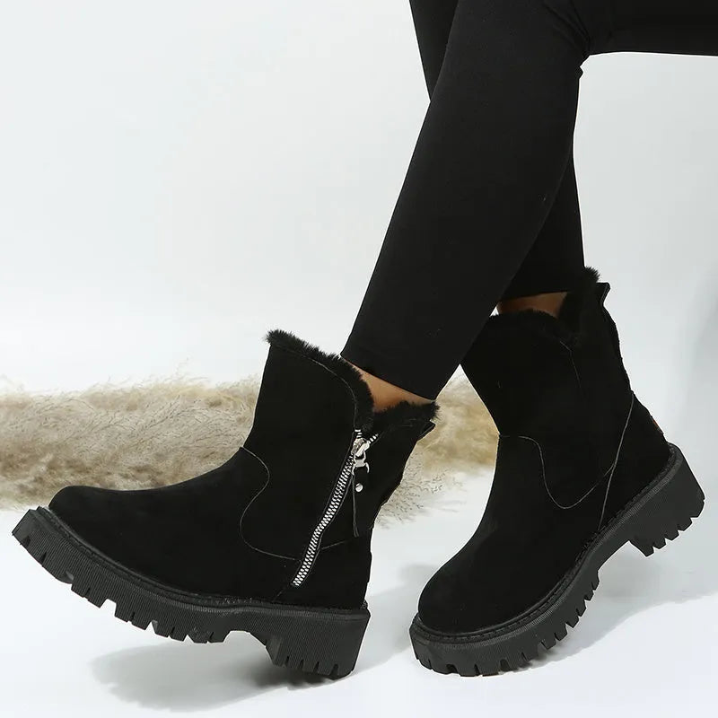 Women's black faux suede high-top snow boot with side zipper on a non-slip rubber sole.