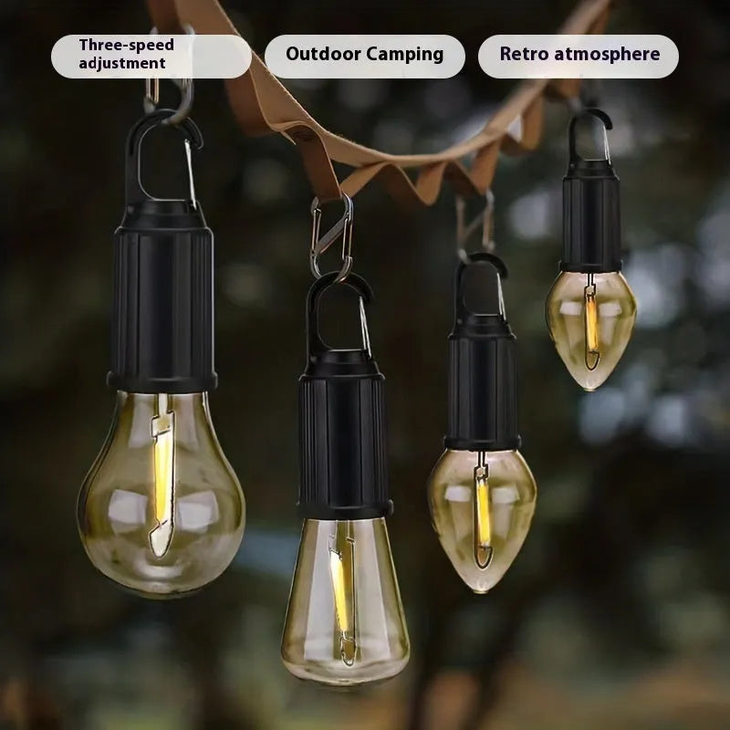 Five solar-powered warm white LED lantern-style light bulbs for outdoor garden use.