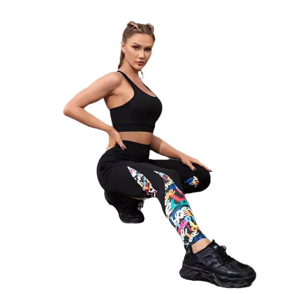 Black women's high-waist fitness leggings with colour-contrast patchwork patterns and side pockets.