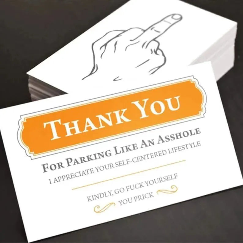 Box of paper illegal parking reminder cards featuring a printed middle finger design.
