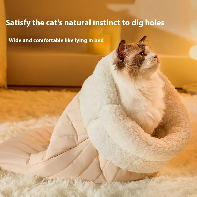 Fleece cat sleeping bag nest in light brown colour with a 3D entrance, shown on a wooden floor.