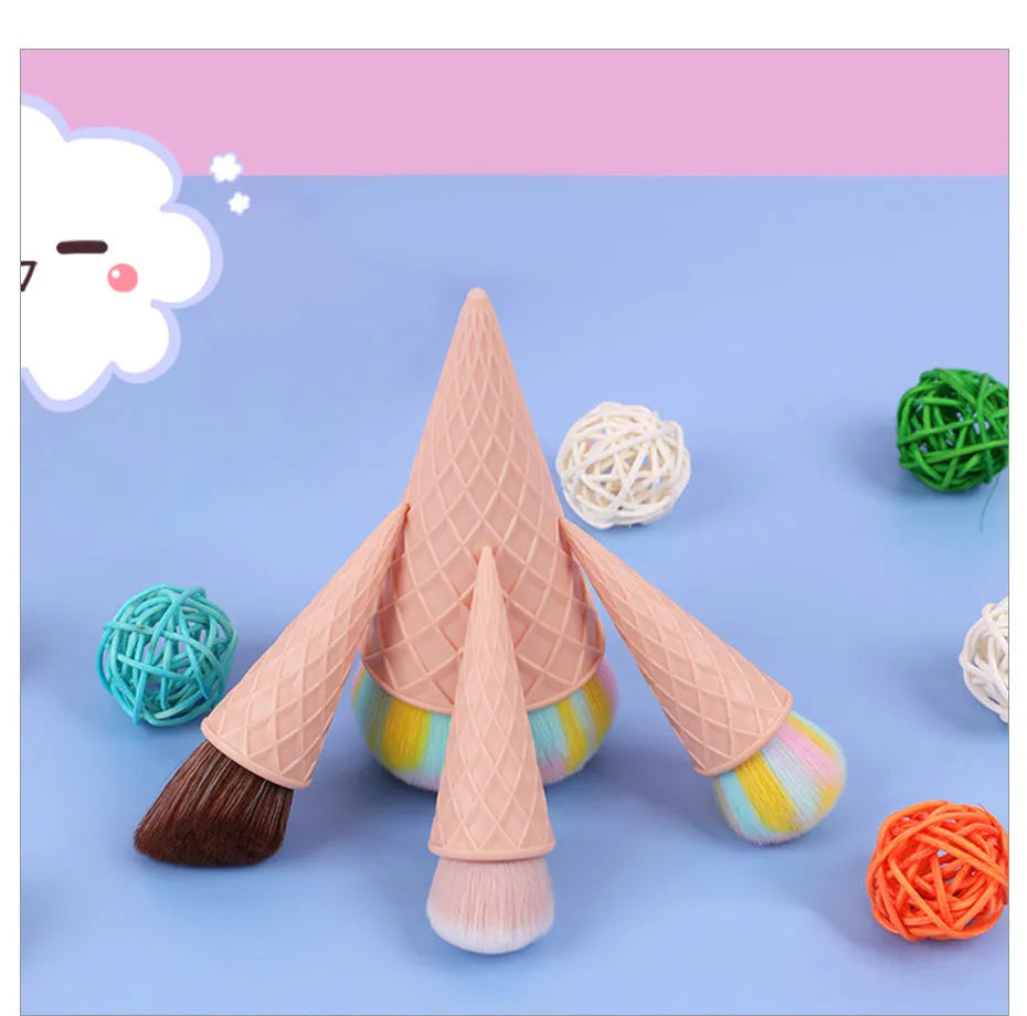 Four-piece makeup brush set with artificial fibre bristles and plastic handles in a paper box