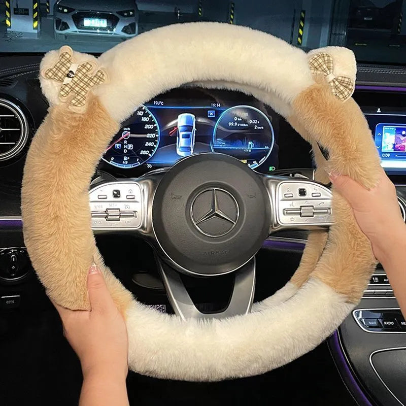 Milk tea white plush steering wheel cover with panda ears on a car steering wheel