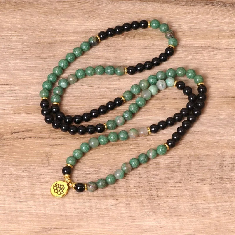 Green and black elastic beaded long bracelet with alloy construction