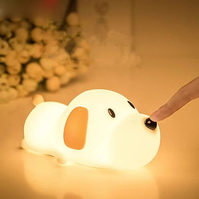 Silicone cartoon dog night light with two colours and a USB cable.