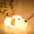 Silicone cartoon dog night light with two colours and a USB cable.