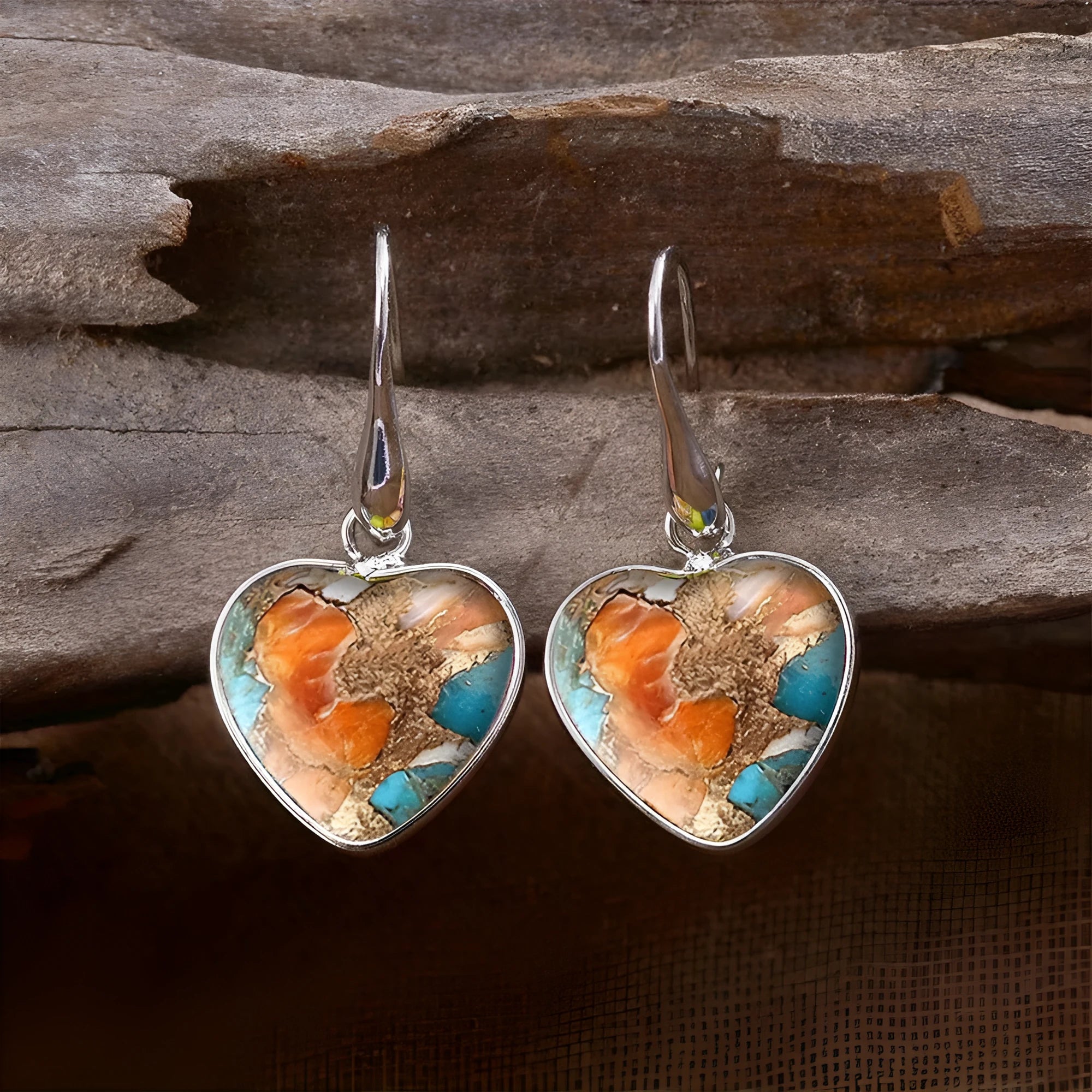 Silver alloy vintage bohemian water droplet pendant drop earrings on light background
