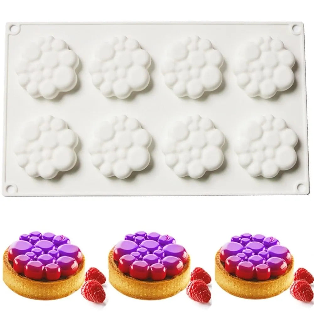 Round silicone cake mould with bubble tower pattern showing 8 raised decorative bubbles