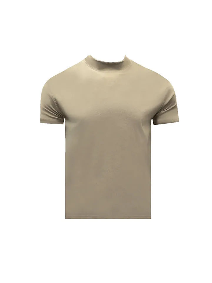 Man wearing a loose-fit grey cotton short-sleeve t-shirt with a half turtleneck cuff shoulder detail.
