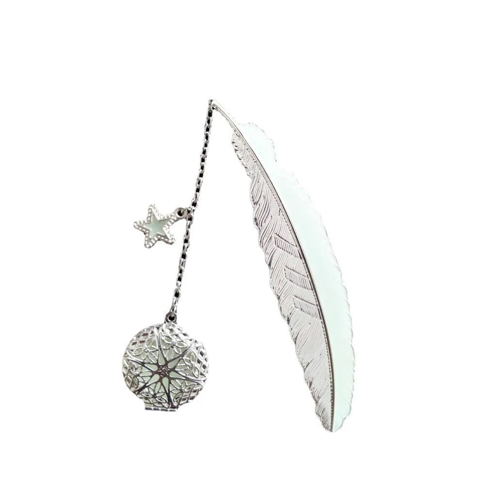 Luminous retro pure copper feather metal bookmark with glow-in-the-dark design showing silver feather and celestial accents