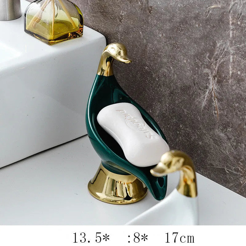 White ceramic swan soap dish with lid cover on bathroom countertop