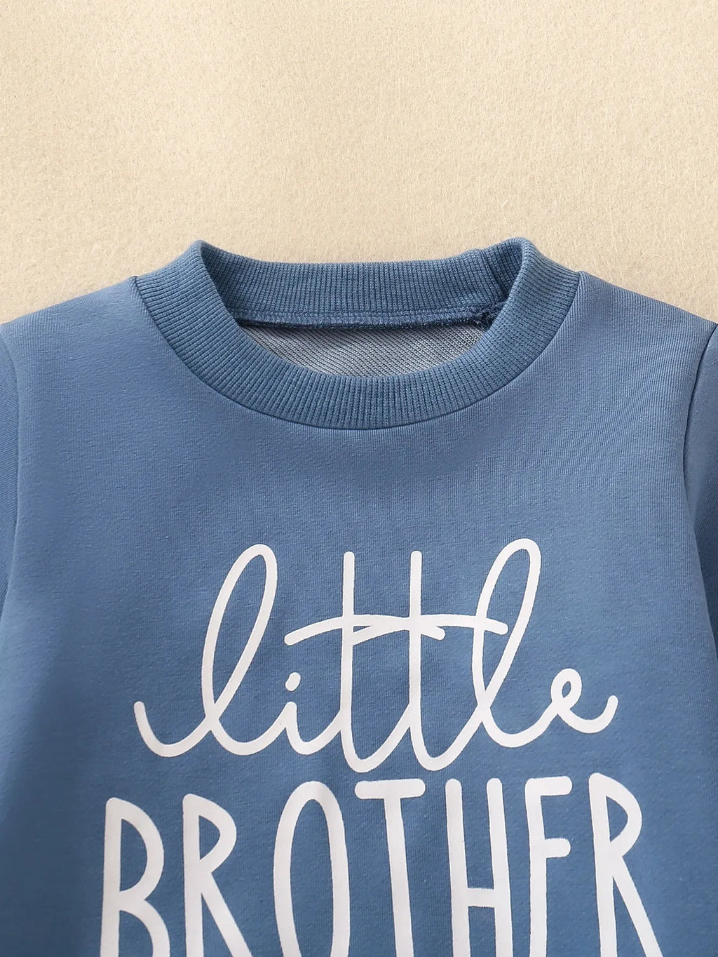 Boys and girls cotton letter sweater suit in dark green with long sleeves and matching pants on a baby