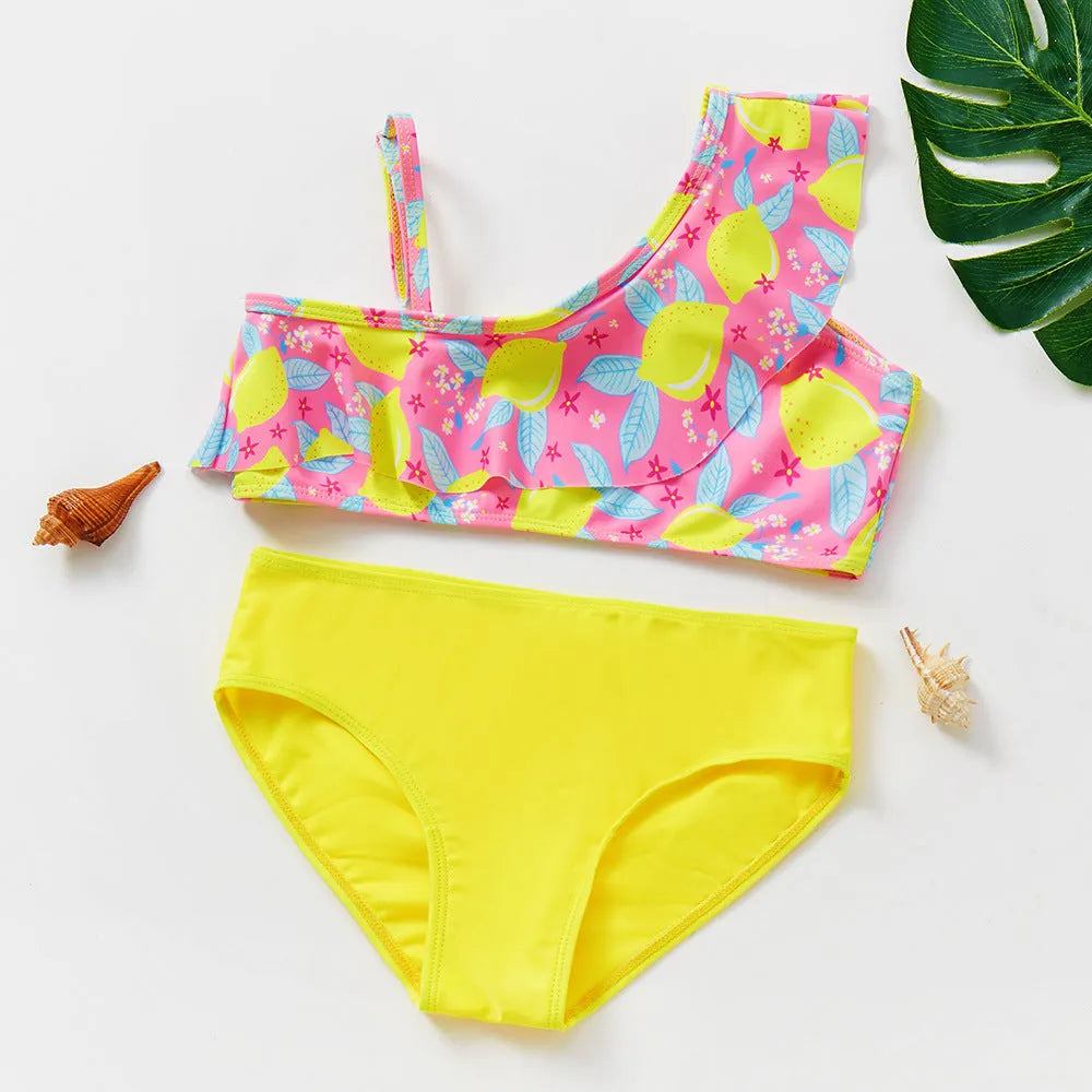 Girls' two-piece swimsuit with oblique shoulder strap, split design, polyester fabric, in butterfly, graffiti, or lemon yellow.