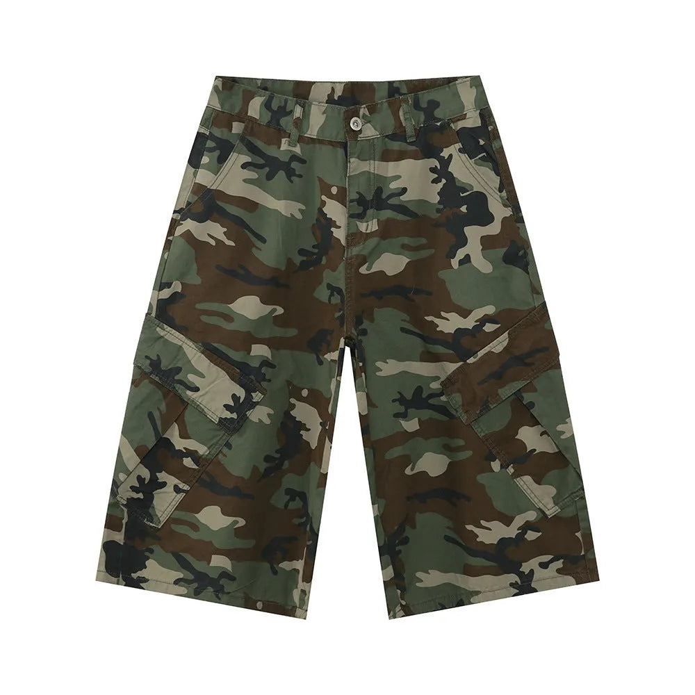 Man wearing loose camouflage print cotton jeans with wide legs and side stitching.