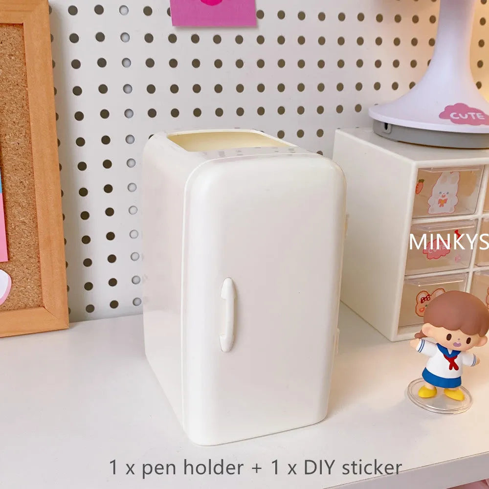 Creative refrigerator-shaped plastic pencil case in white, light blue, and pink colour options on a desk