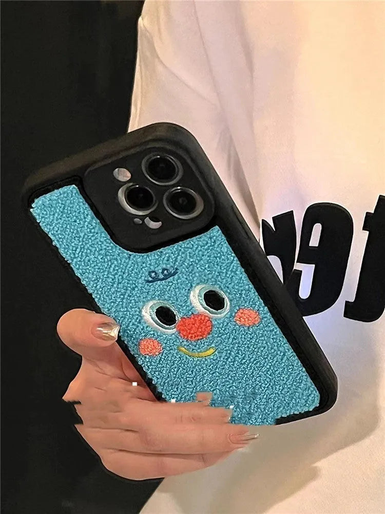 Blue silicone phone case with towel embroidered texture for iPhone, showing rear and side view