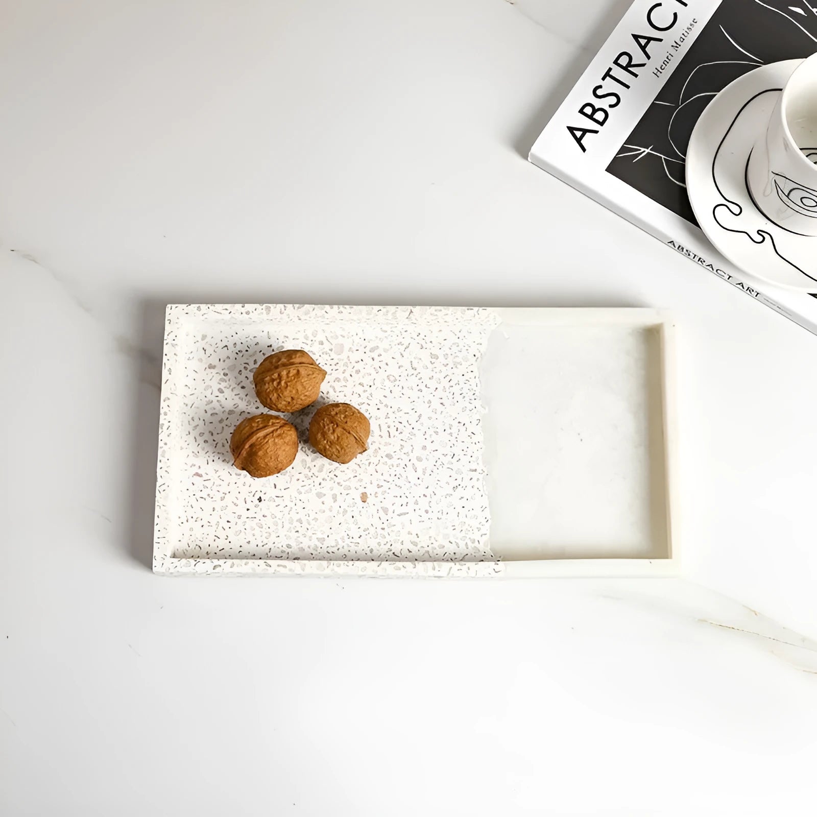Resin terrazzo decorative storage tray 26.5x14x2cm in colour SZ23038 on a coffee table