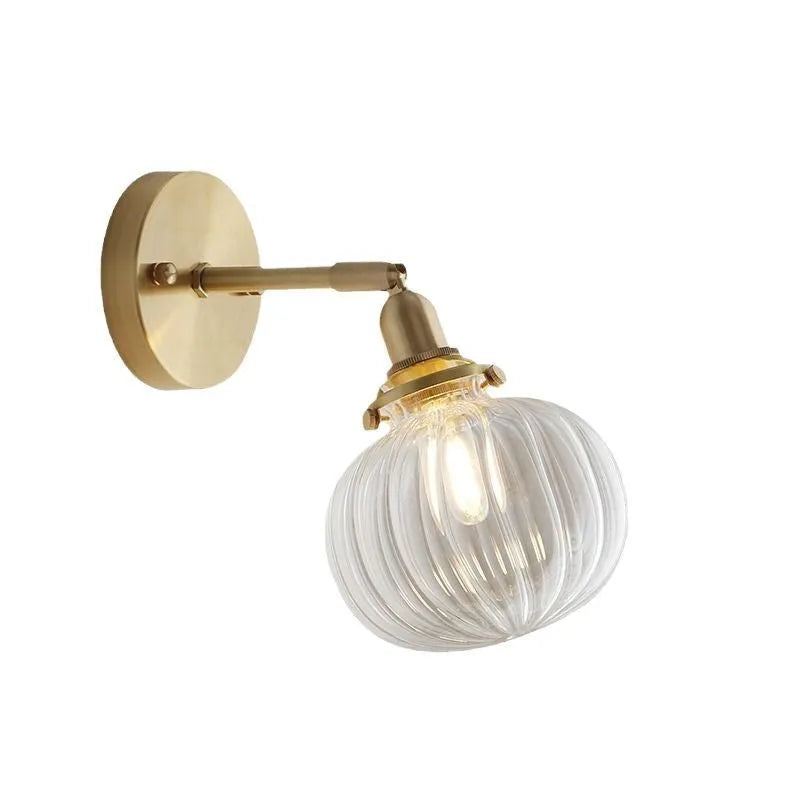 Creative pumpkin-shaped wall lamp with hand-blown water ripple glass shade mounted on a brushed nickel bracket.