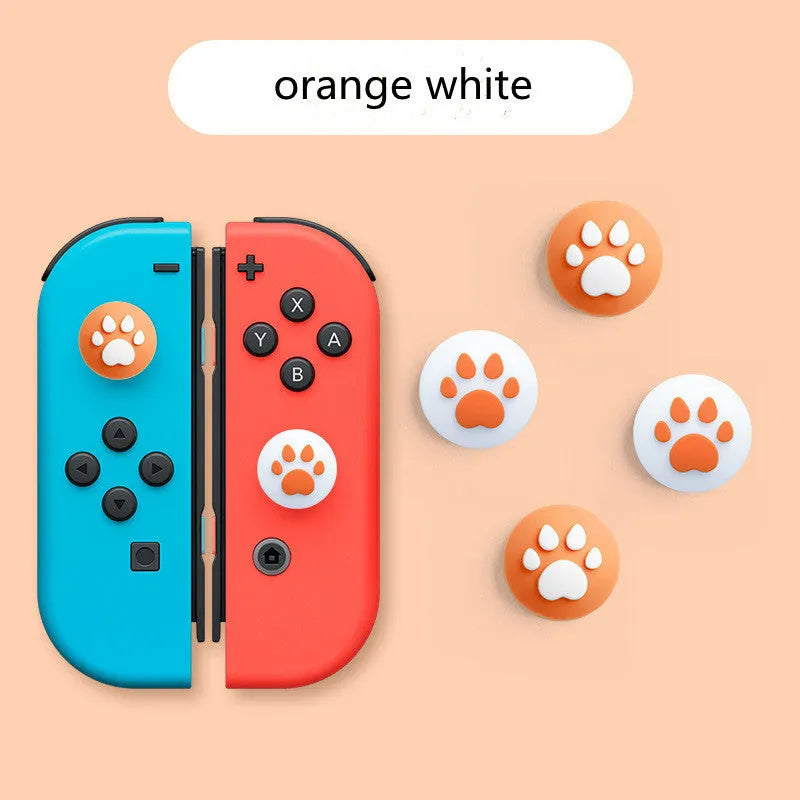 Set of four silicone cat claw key caps for Nintendo console joysticks in various colours.