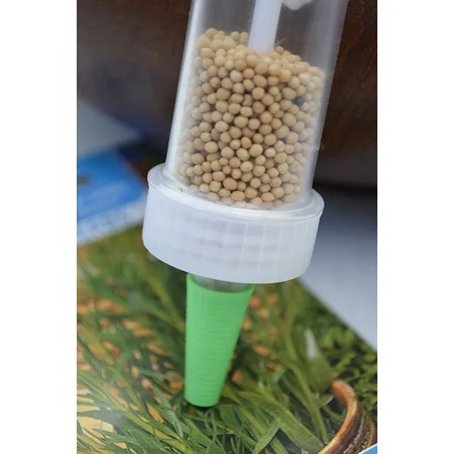 12cm long plastic mini garden seeder tool with button mechanism for container planting