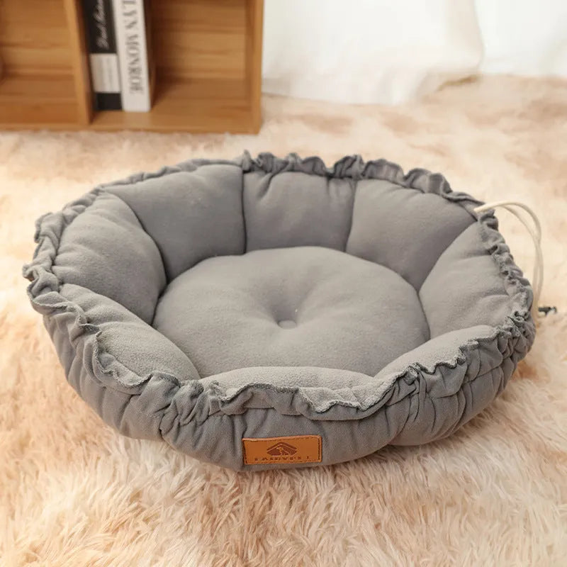 Grey reversible donut pet bed with raised rim for cats and small dogs