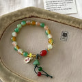 M990 Lotus Ruyi bracelet showing mixed material construction and lotus decorative element