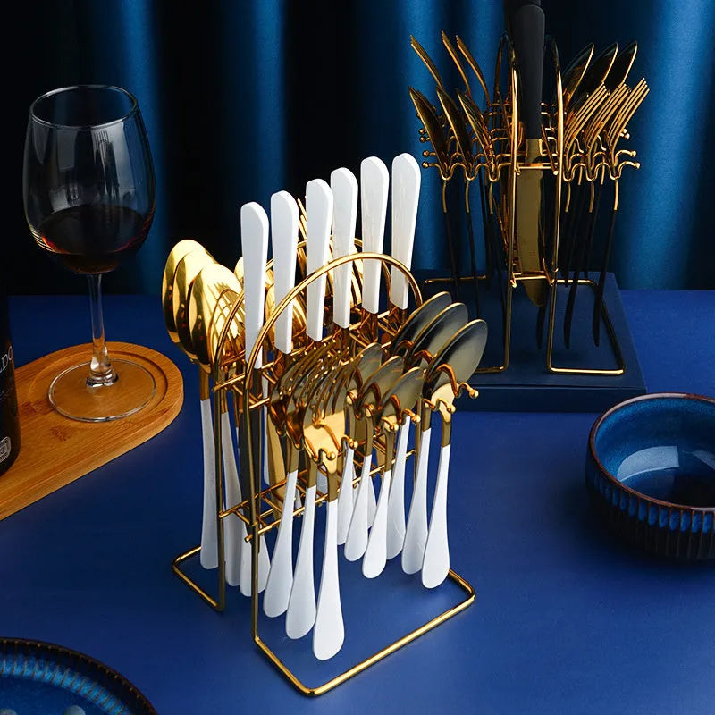 Gold stainless steel 24-piece cutlery set with knives, forks, spoons, tea spoons and a storage rack.