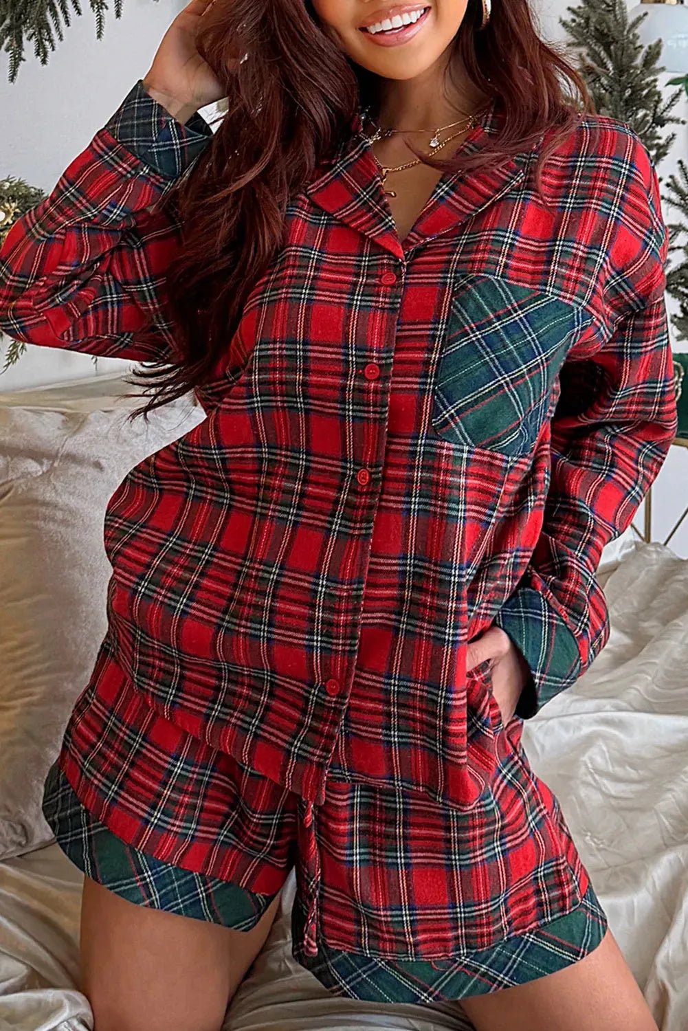 Red plaid long sleeve shirt and shorts Christmas pajama set with contrast patch details.