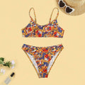 Plus size women's floral print strap bikini swimsuit set in brief style on a mannequin