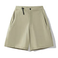 Men's khaki sports shorts with 3D cut and four-way stretch fabric for running and climbing.