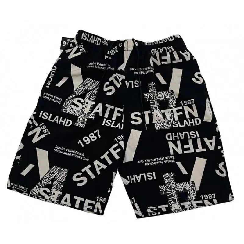 Men's loose beach trousers in ice silk fabric with striped pattern, elastic waist, and quick-drying properties