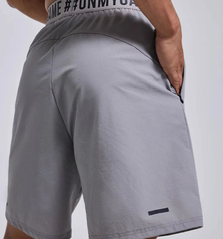 Men's loose black sports shorts with elastic waistband and letters design detail