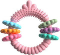 Blue TPR rubber ring dog chew toy with squeaker for small dogs on a white background.