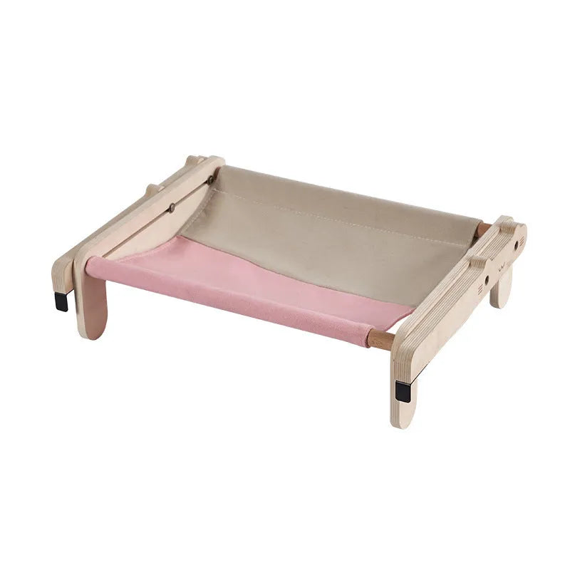 Solid wood cat bed with a removable fabric cover in a grey pink colour.