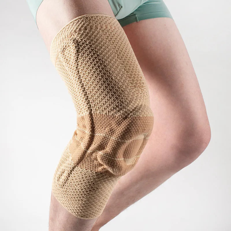 Adult sports knee pad in black and blue colour, made from nylon and spandex material.