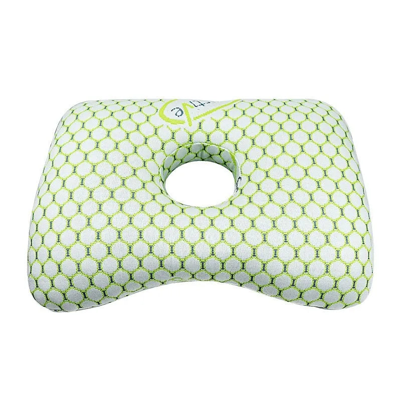 Beauty salon single hole ear pillow in grey on a treatment bed.