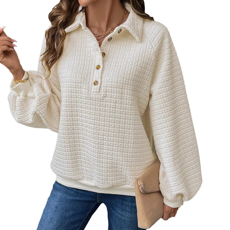 Women's solid colour polo collar sweater with long sleeves in a textured knit.