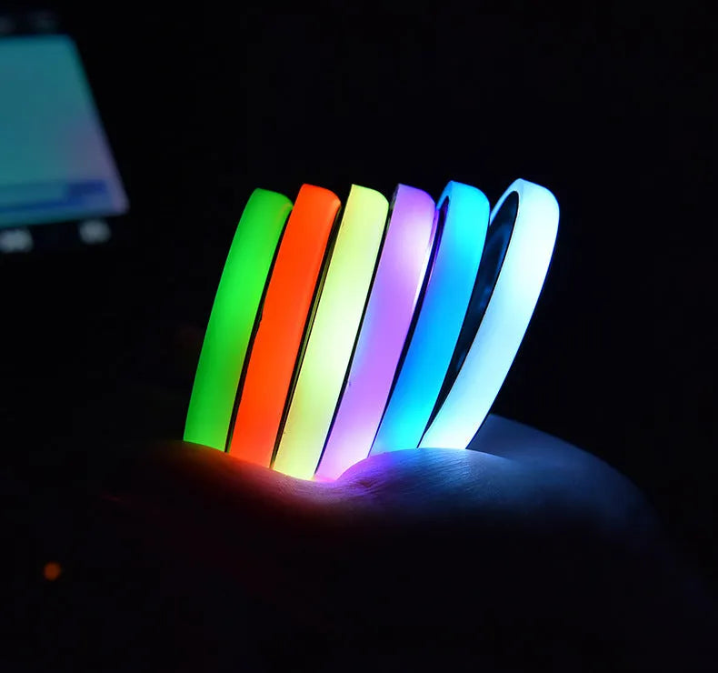Colourful LED light-up coaster for car cup holder with USB cable and solar charging.