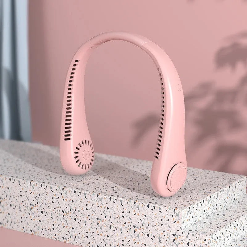 Blue bladeless neck fan being worn, showing the flexible neckband and the safe air outlet.