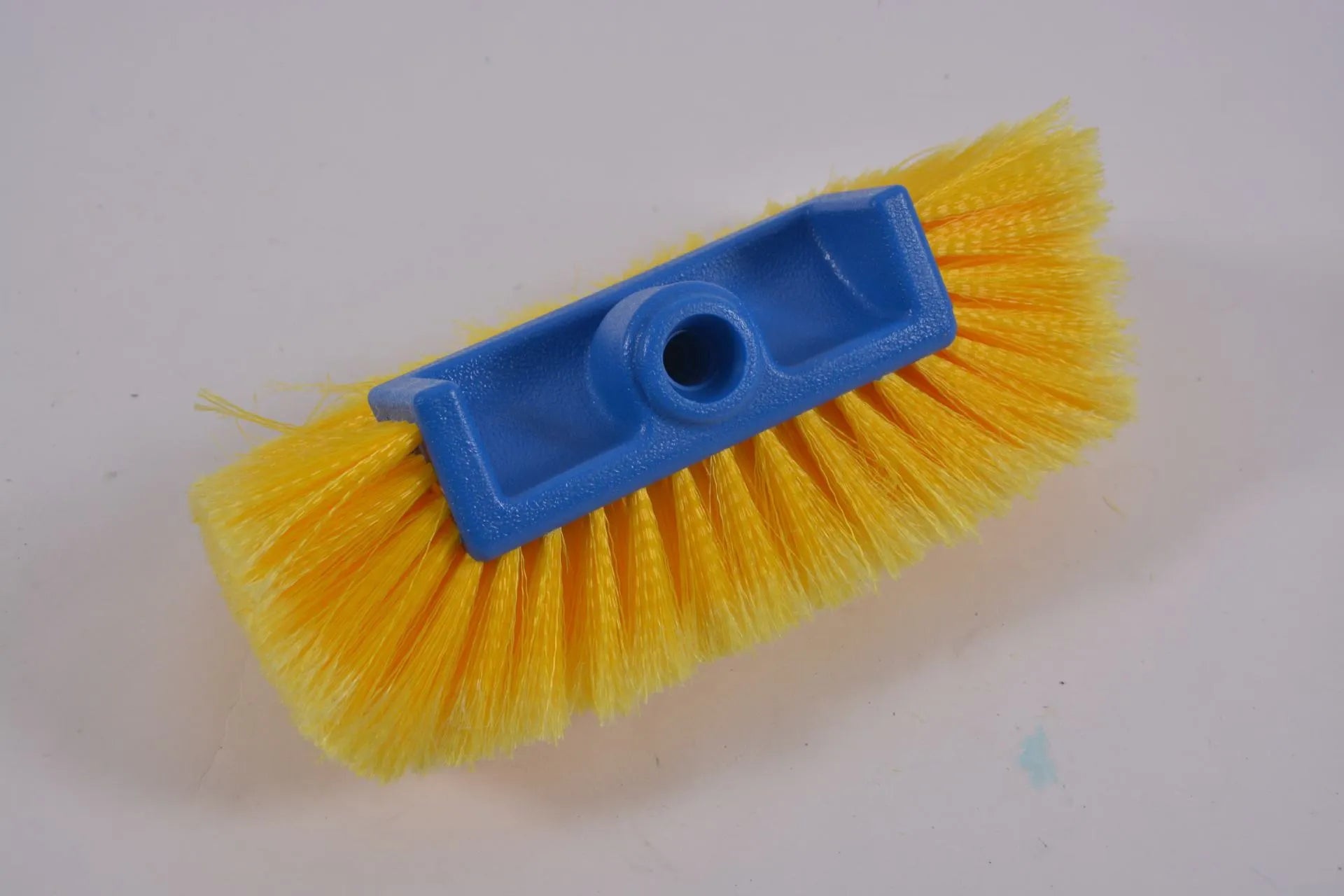 Yellow portable car wash brush with four-section removable rod and flow-through brush head design