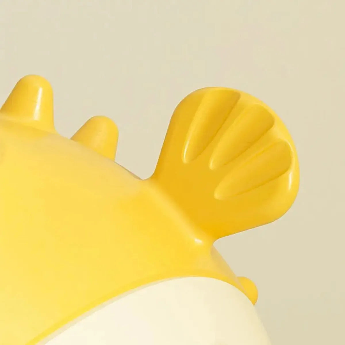Yellow fish-shaped durable vinyl dog chew toy with textured surface for aggressive chewers.