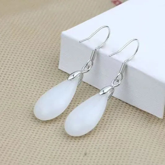 Natural Hetian water drop jade earrings on display showing gray jade colour with alloy ear wire