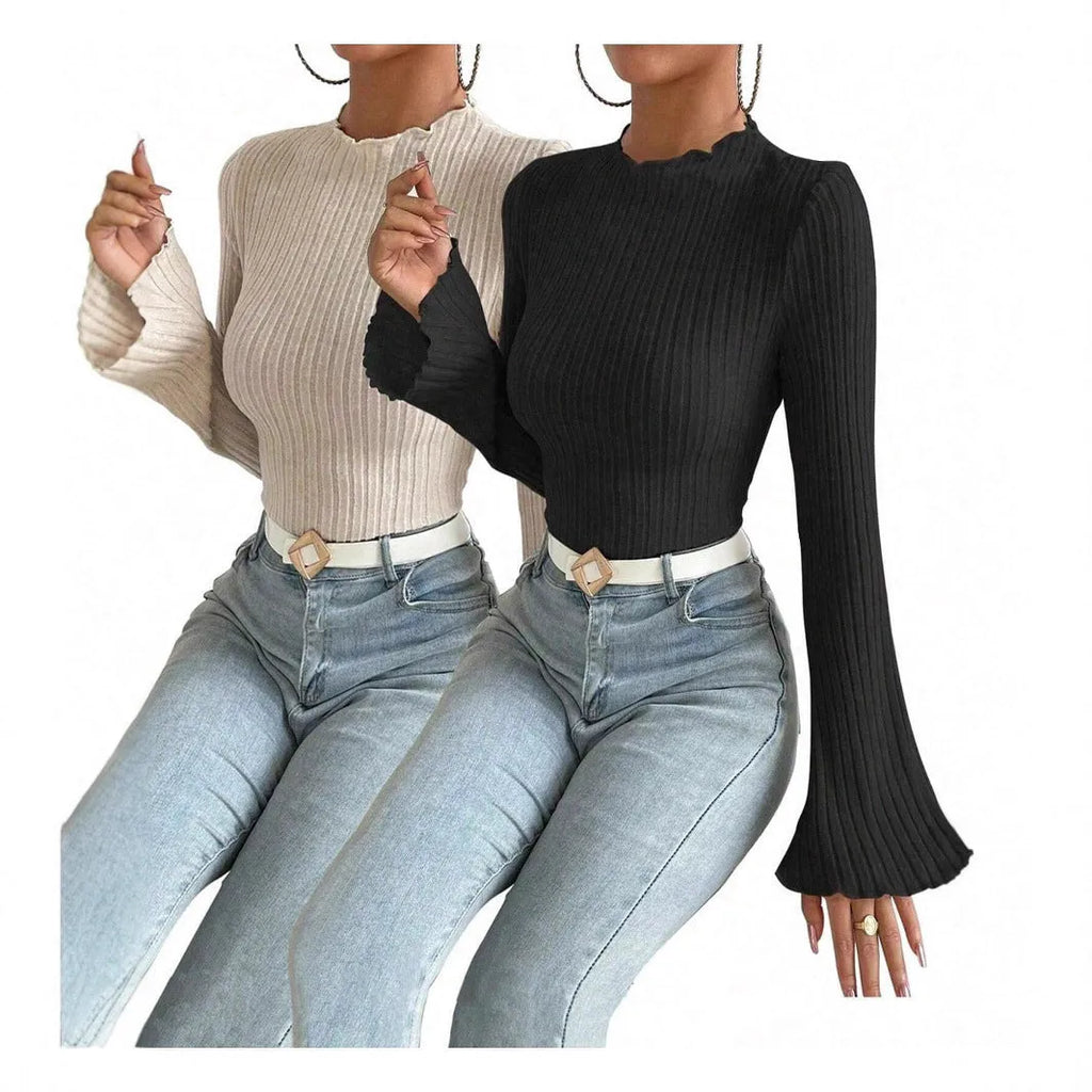 Black long sleeve slim fit top with round neck and lantern sleeves.