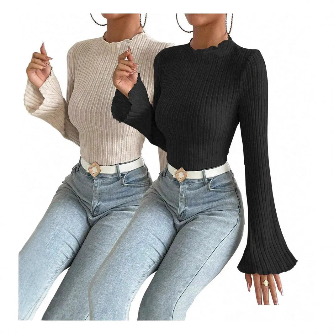 Black long sleeve slim fit top with round neck and lantern sleeves.
