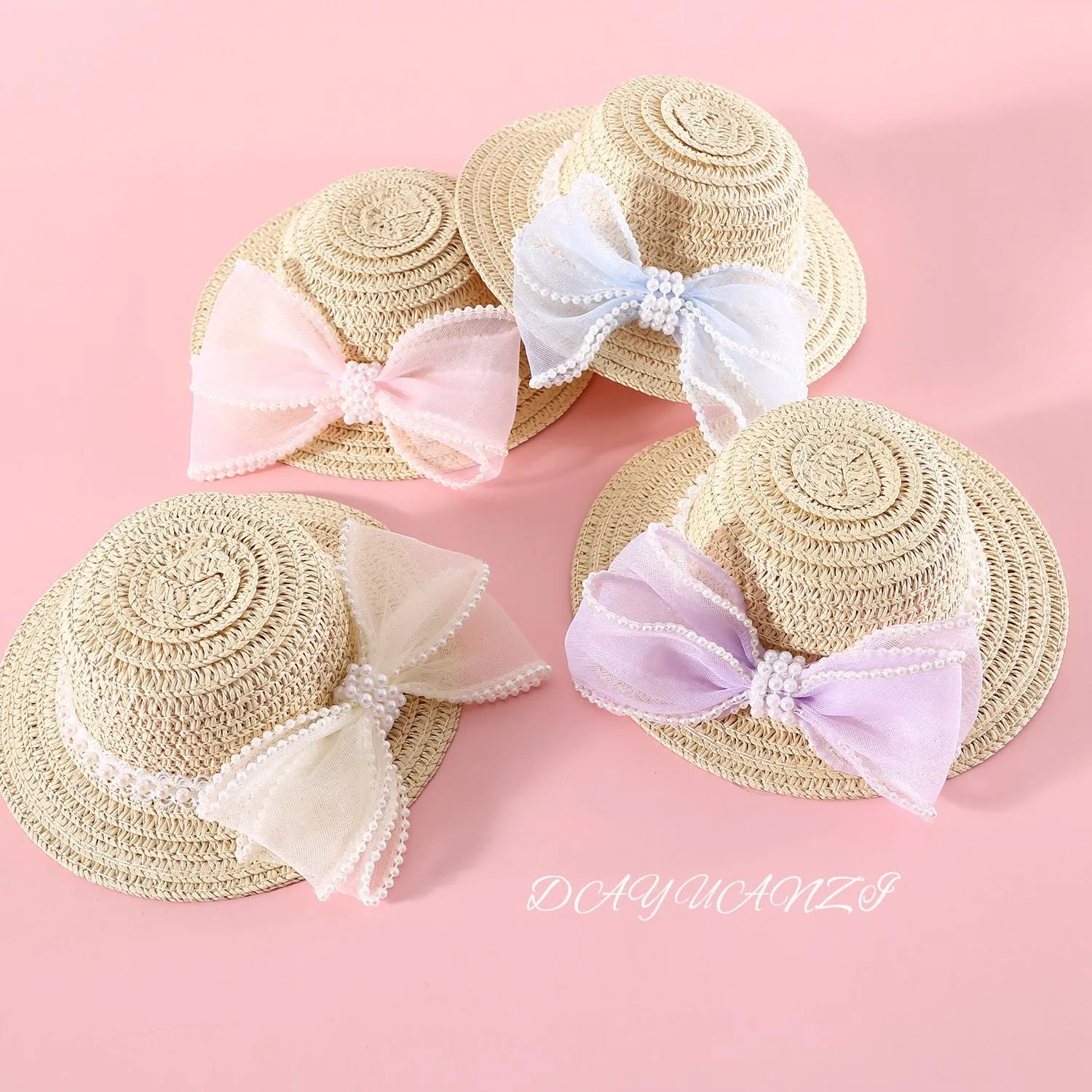 Cat wearing woven straw hat with pearl bow decoration in princess style