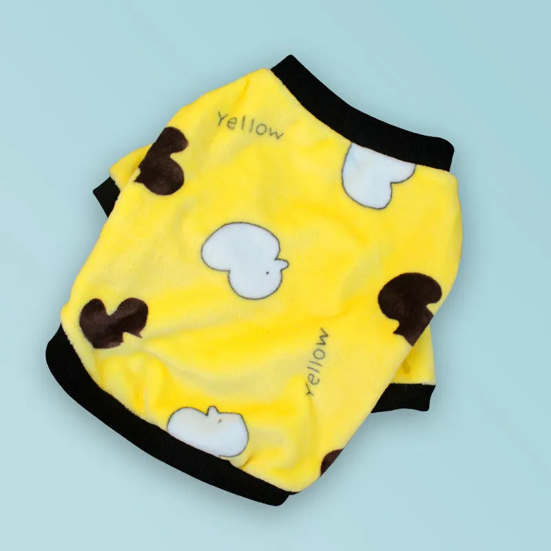 Female corgi wearing winter dog pajamas in coral fleece with plain pattern, showing bear style colour, side view
