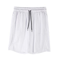 Man wearing loose-fit black quick-dry mesh shorts for casual summer sportswear.
